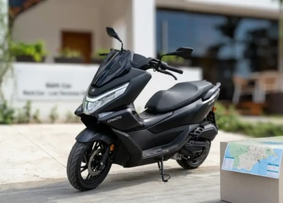 Matte black CF Moto 150cc automatic scooter for rent parked in front of ACT Rent Car office in Las Terrenas.